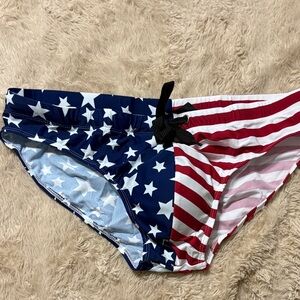 - Red white and blue American flag men’s swimwear